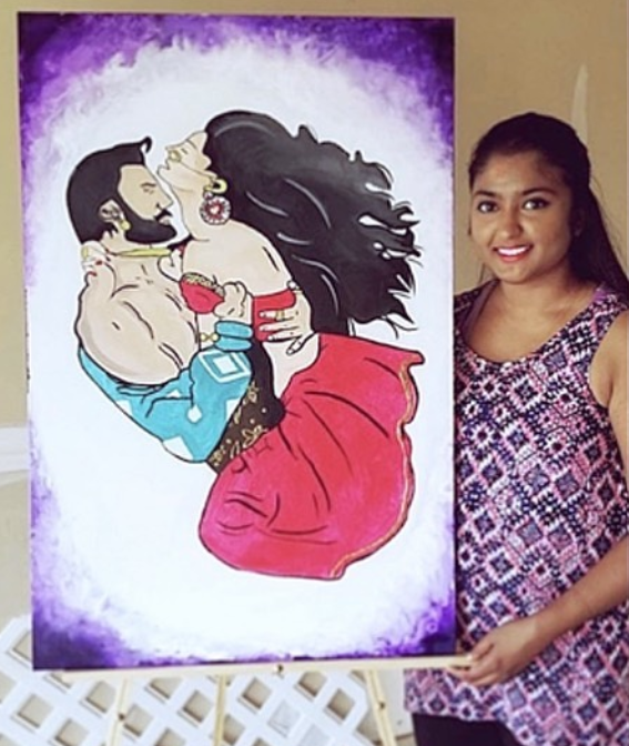 Artist holding the finished graphic couple portrait